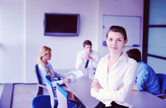 business woman  with her staff,  people group in background at modern bright office indoors