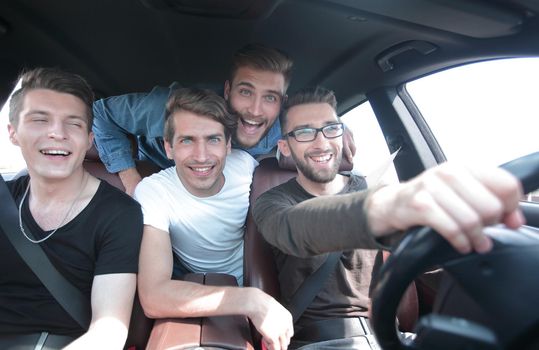 close up.funny friends travel in the car