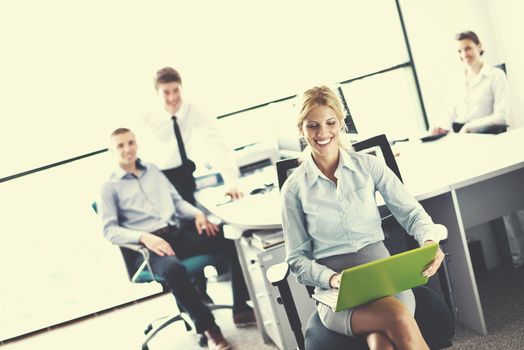 business woman  with her staff,  people group in background at modern bright office indoors