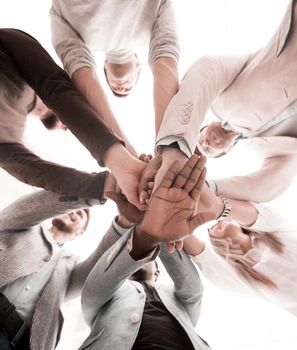 business background.business team making a stack of hands. the concept of unity