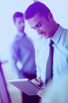 close-up of human hand  business man using tablet compuer at office