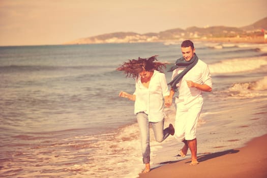 happy young couple in white clothing  have romantic recreation and   fun at beautiful beach on  vacations