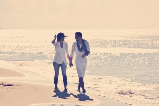 happy young couple in white clothing  have romantic recreation and   fun at beautiful beach on  vacations