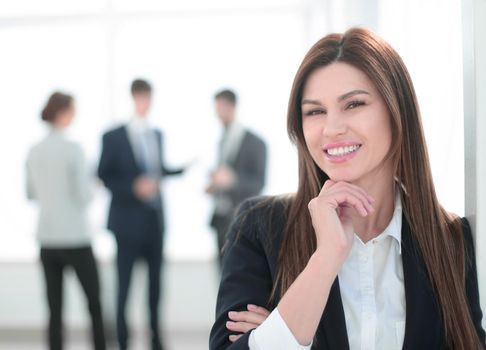 portrait of smiling business woman on blurred office background.photo with copy space