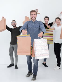 group of cheerful young people with shopping bags.photo with text space