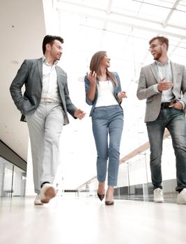 Business people walking in the office corridor.business concept