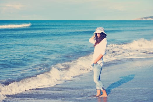 happy young woman relax onbeautiful  beach at morning