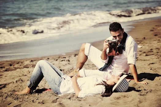 happy young couple relaxing in nature white making photos and taking images and posing for camera