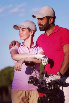 portrait of happy young  couple on golf course