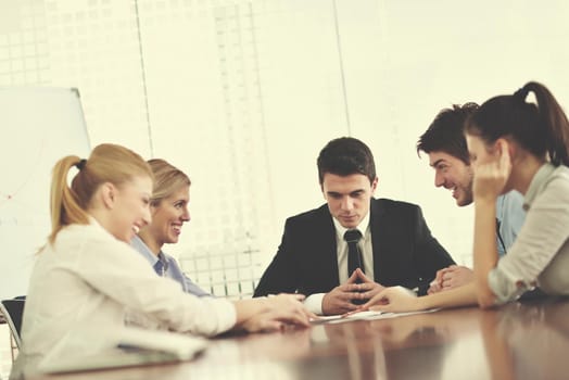 Group of happy young  business people in a meeting at office