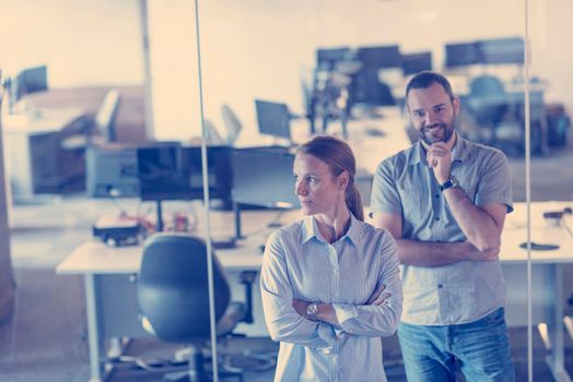 business couple working together on project at modern startup office