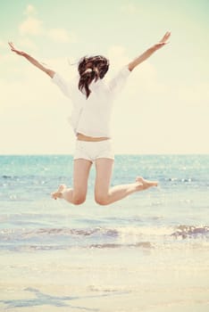 beautifel and happy woman girl on beach have fun and relax on summer vacation  over the beautiful tropical sea