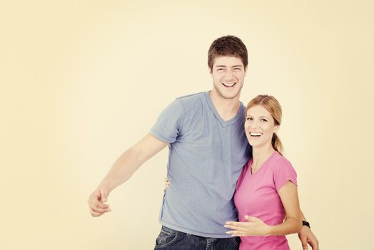 happy young couple paint in green and blue color white wall of their new home