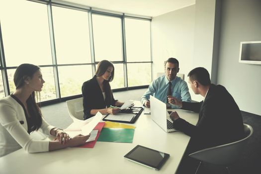 Group of happy young  business people in a meeting at office