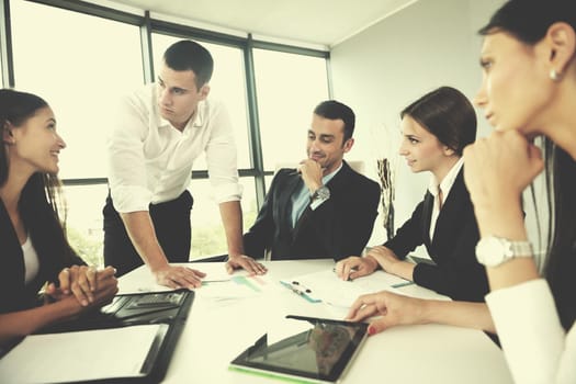 Group of happy young  business people in a meeting at office