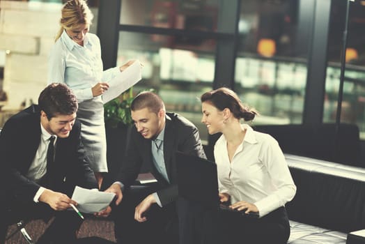 Group of happy young  business people in a meeting at office