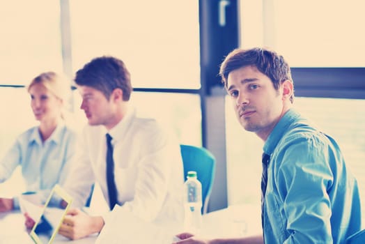 Group of happy young  business people in a meeting at office