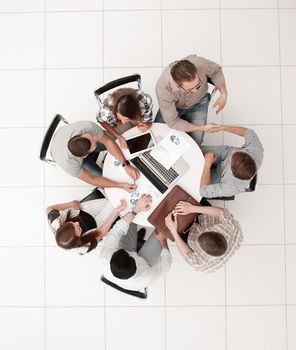 top view.staff welcoming each other at the working meeting. the concept of teamwork