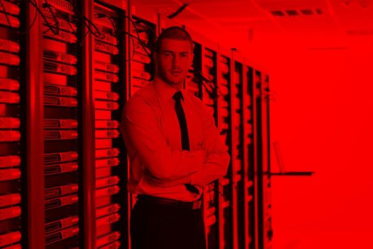 young handsome business man  engeneer in datacenter server room