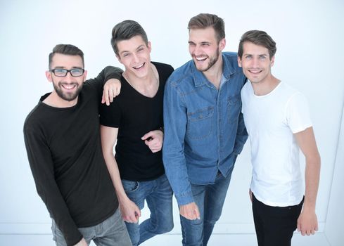 top view..a group of happy young men looking at the camera.isolated on white