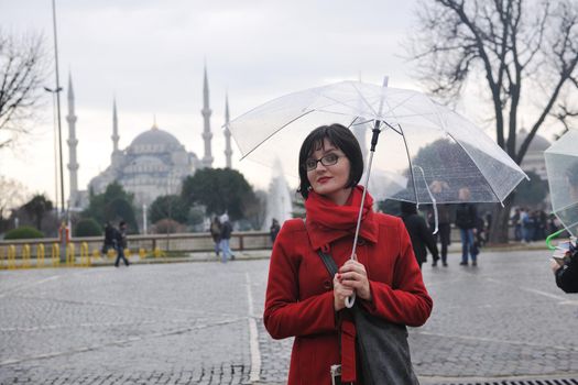 happy young tourist woman travel visit ancient istambul in turkey and old ayasofya blue mosque