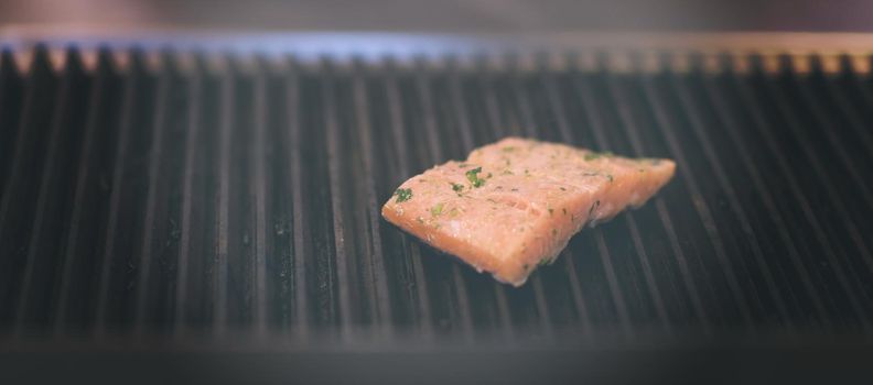 Salmon fillets cooking on grill