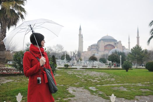 happy young tourist woman travel visit ancient istambul in turkey and old ayasofya blue mosque