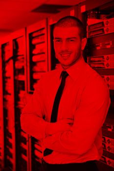 young handsome business man  engineer in datacenter server room