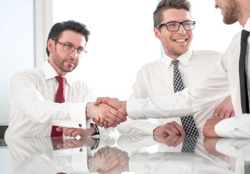 employees greet each other with a handshake.business concept