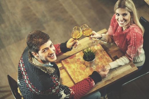 romantic evening date in restaurant  happy young couple with wine glass tea and cake