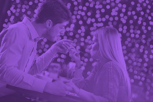 romantic evening date in restaurant  happy young couple with wine glass tea and cake