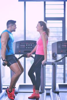 attractive couple at the gym looking happy