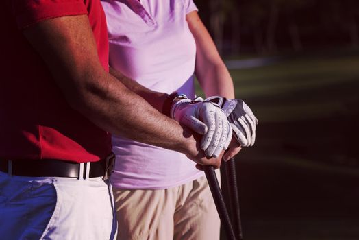 portrait of happy young  couple on golf course