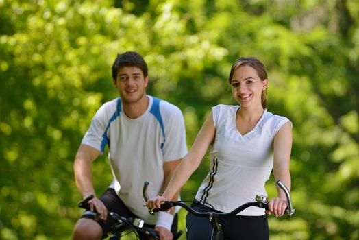 Young couple jogging in park at morning. Health and fitness.