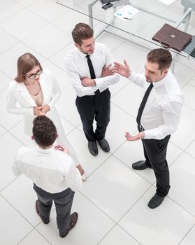 top view.employees of the company discussing new ideas.photo with copy space