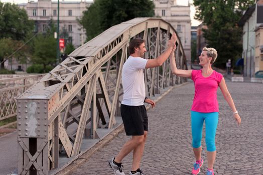 jogging friends couple congratulate and happy to finish their morning workout