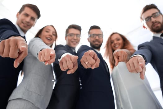 close up.successful business team pointing at you.the concept of choice