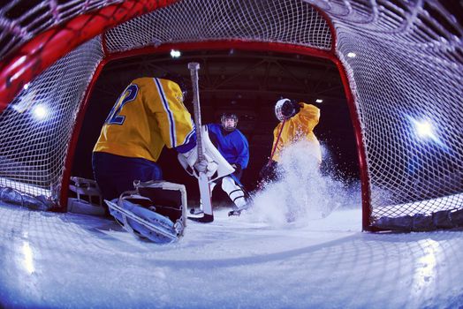 ice hockey goalkeeper  player on goal in action