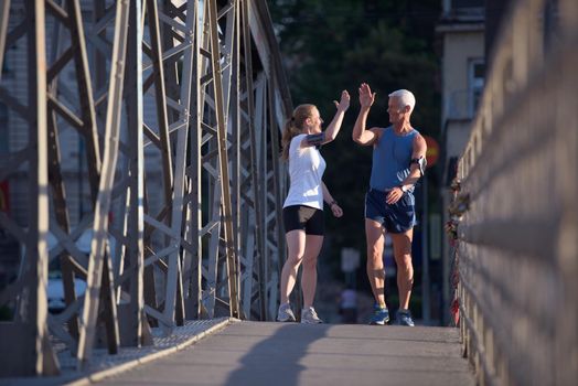 jogging friends couple congratulate and happy to finish their morning workout