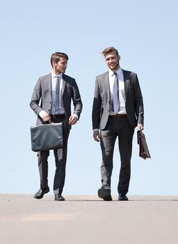 business people walking on the city street .photo with copy space