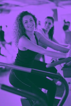 group of young people running on treadmills in modern sport  gym duo tone