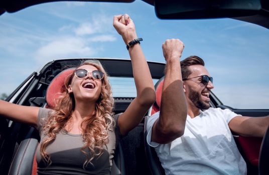 close up.a loving couple travelling in a convertible.rest and travel.