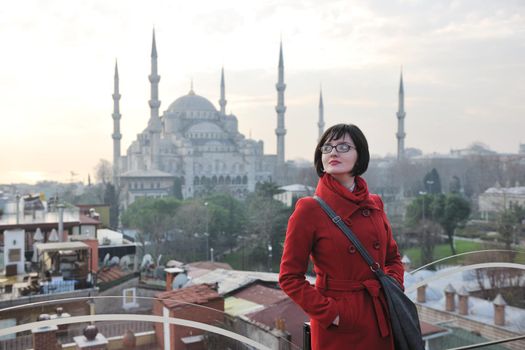 happy young tourist woman travel visit ancient istambul in turkey and old ayasofya blue mosque