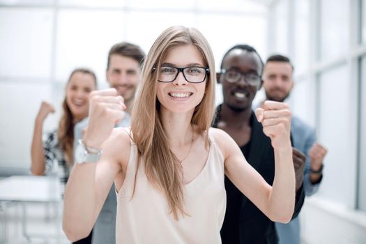 A group of business people from different ethnic backgrounds rejoices and celebrates their success in the financial and economic fields