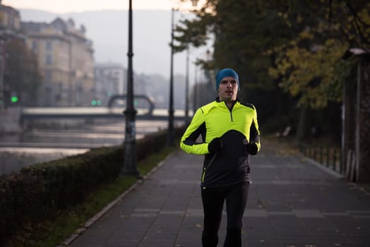 man jogging  at cold autumn  mornigng