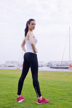 Young beautiful  woman jogging and running  on morning at  park in the city. Woman in sport outdoors health and fitness concept