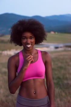 Healthy Looking Smiling Young African American Female beautiful summer evening in nature