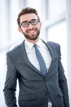 smiling businessman on the background of the office.business people