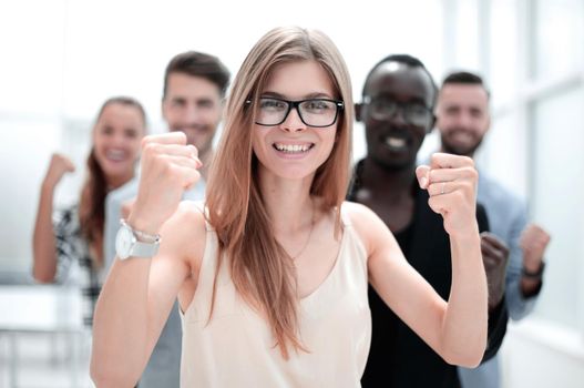 A group of business people from different ethnic backgrounds rejoices and celebrates their success in the financial and economic fields