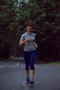 runner   woman warming up and stretching before morning jogging